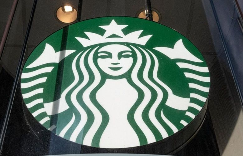 A Starbucks coffee shop sign , on Thursday, Jan. 21, 2021. Photographer: David Paul Morris/Bloomberg