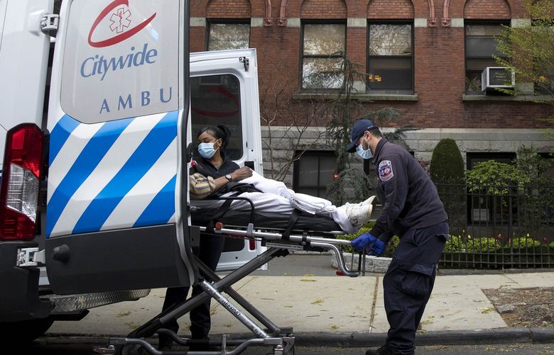 FILE — An ambulance crew transports a person at a nursing home in Brooklyn, April 20, 2020. The administration of former Gov. Andrew Cuomo failed to publicly account for the deaths of about 4,100 nursing home residents in New York during the pandemic, according to an audit released on Tuesday, March 15, 2022, by the state comptroller, Thomas P. DiNapoli. (Dave Sanders/The New York Times) XNYT223 XNYT223