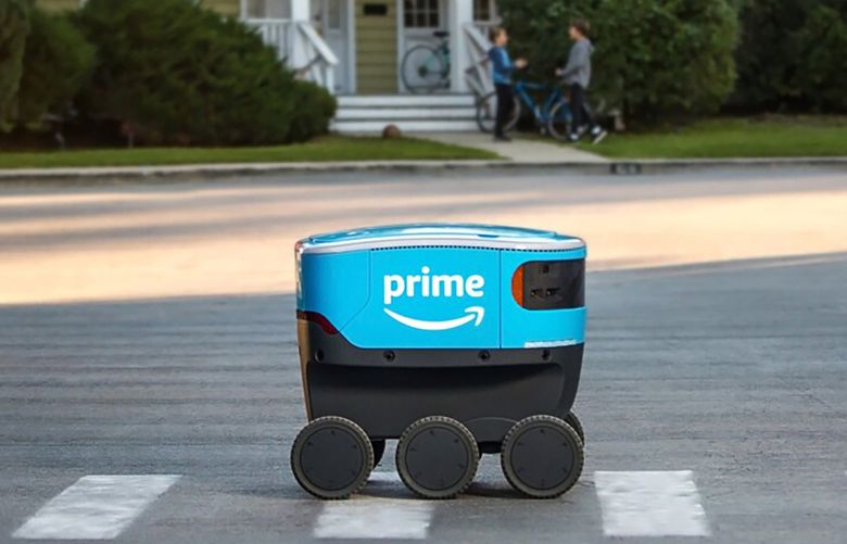 Amazon Scout navigates through a neighborhood. The Kirkland City Council has issued a moratorium on Amazon using its Scout robots to deliver items.