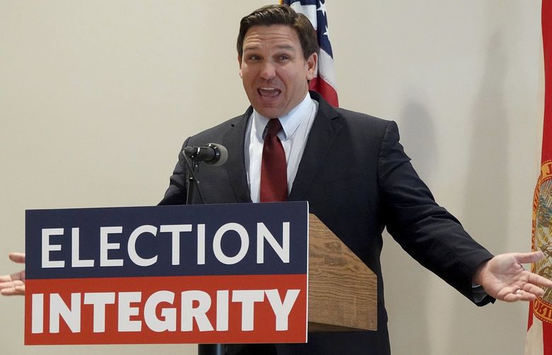 FILE – Florida Gov. Ron DeSantis asks the crowd “How about Virginia,” as he arrives at an event in West Palm Beach, Fla., to announce proposed election reform laws, Wednesday, Nov. 3, 2021.  Republicans promoting claims of widespread voter fraud in at least two politically important states are turning to a new tactic to appease voters who falsely believe the 2020 presidential election was stolen: election police. The efforts in Florida and Georgia to establish law enforcement units dedicated to investigating voting or election crimes come as Republican lawmakers and governors move to satisfy the millions of voters in their party who believe former President Donald Trumpâ€™s false claims that widespread voter fraud cost him re-election.   (Joe Cavaretta/South Florida Sun-Sentinel via AP) FLLAU402 FLLAU402