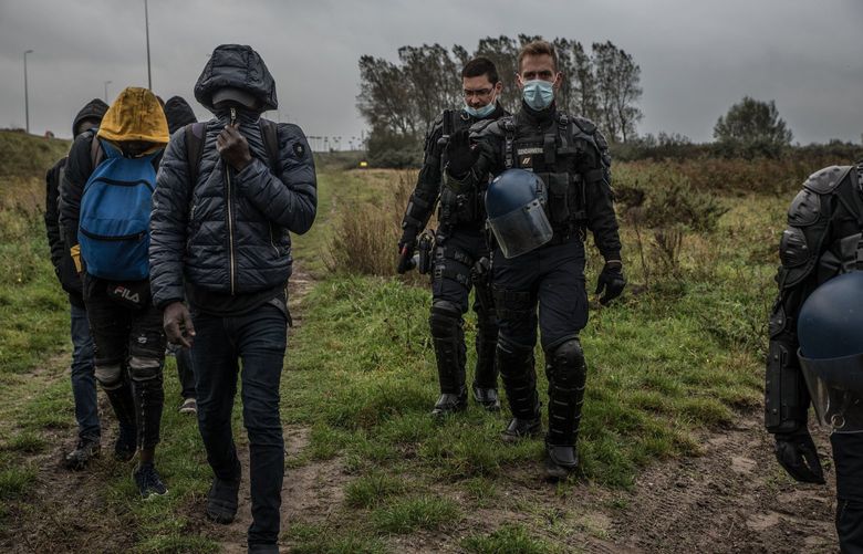 French police force people out of refugee camps on the outskirts of Calais in October 2020. MUST CREDIT: Photo for The Washington Post by Emilienne Malfatto.
