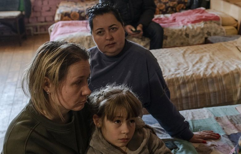 Miroslava Patsyadi, left, came with her family from Bila Tserkva to the Carpathian Mountains. MUST CREDIT: Photo for The Washington Post by Kasia Strek.