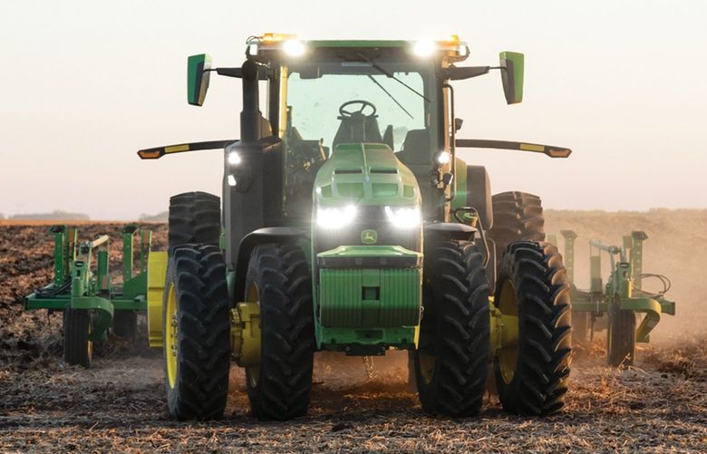 This 2021 photo provided by John Deere shows an autonomous tractor plowing a field, without a driver, on a farm in Blue Earth, Minn. (Bill Krzyzanowski/John Deere via AP) 