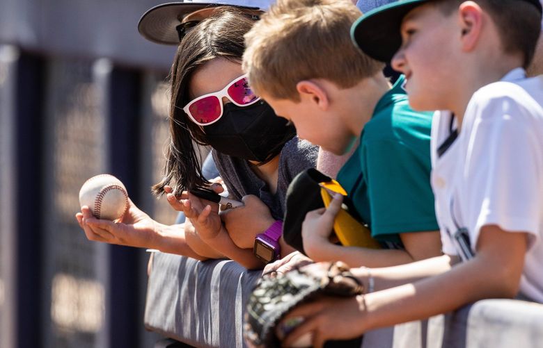 ­Young fans line the fence hoping to get an autograph from Mariners players as they arrive for Friday’s Spring Training game with the San Diego Padres.

The Seattle Mariners played the San Diego Padres in the first game of Spring Training Friday, March 18, 2022 at Peoria Sports Complex in Peoria, AZ. 219854