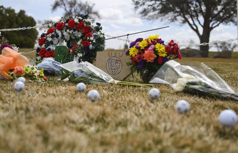 A memorial erected in honor of the University of the Southwest golf teams car wreck is seen Thursday, March 17, 2022 at the Rockwind Community Links in Hobbs, N.M. Late Tuesday, the University of the Southwest men’s and women’s golf teams were involved in a fatal car crash half a mile north of State Highway 115 on Farm-to-Market Road 1788 in Andrews County while on the way back from tournament play in Midland. Nine people were killed in the wreck including six students, one coach, and two in a pickup that collided head-on with the university’s van. (Eli Hartman/Odessa American via AP) TXODE209 TXODE209