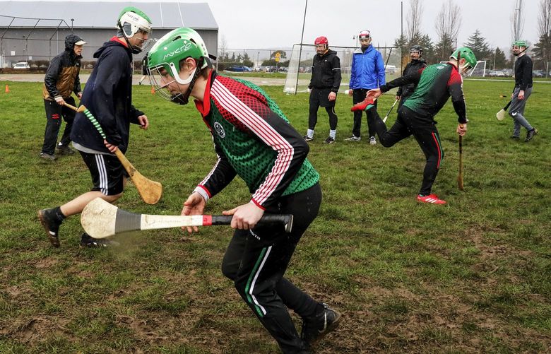 Participants at the Seattle Gaels’ open field day at Magnuson Park for players and those wishing to learn the rules and skills of Gaelic football, hurling and camogie warm up and go through drills on Saturday March 19, 2022.

SEE:   more info at seattlegaels.com

Ref to more photos online 219912