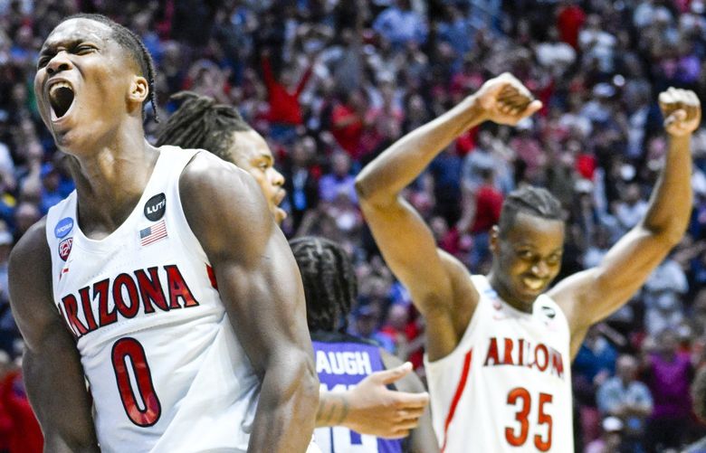 Arizona guard Bennedict Mathurin (0) and center Christian Koloko (35) react at the end of overtime in a second-round NCAA college basketball tournament game against TCU, Sunday, March 20, 2022, in San Diego. Arizona won 85-80. (AP Photo/Denis Poroy) WATW241