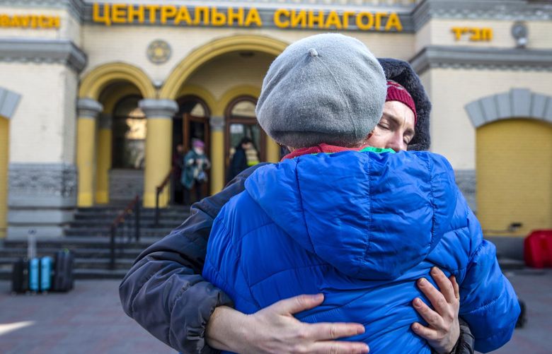 Olena Nykyporets hugs her mother-in-law, Tatyana Lepyavko, as they stand outside the Brodsky Synagogue in Kyiv on March 19. MUST CREDIT: Photo for The Washington Post by Heidi Levine