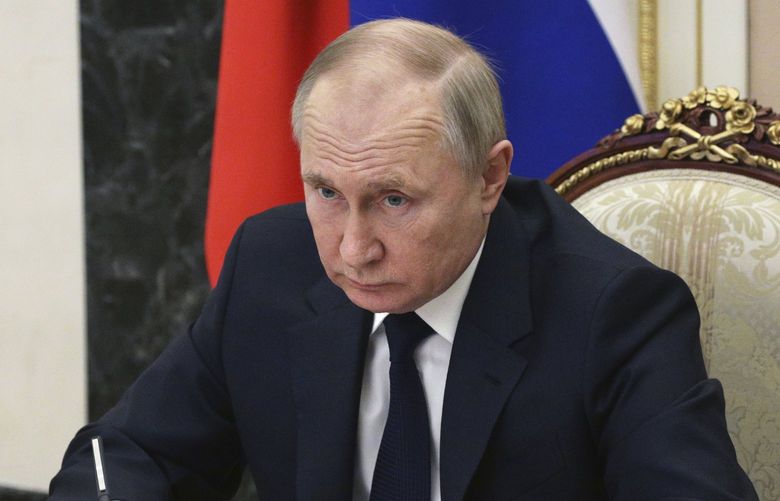 FILE – Russian President Vladimir Putin chairs a meeting with members of the government via teleconference in Moscow, Thursday, March 10, 2022. (Mikhail Klimentyev, Sputnik, Kremlin Pool Photo via AP, File) WX201 WX201