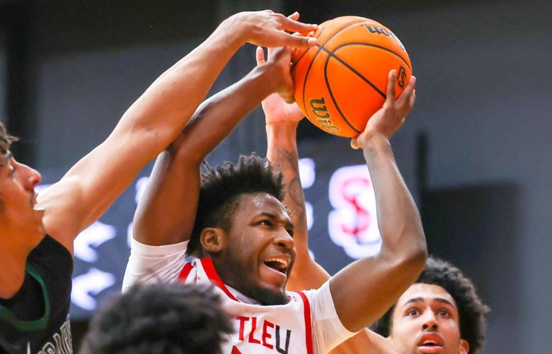 Seattle Redhawks guard Darrion Trammell (2) guides the ball to the hoop during the second half of a basketball game between Seattle Redhawks and Chicago State Cougars on March 5, 2022. 219765