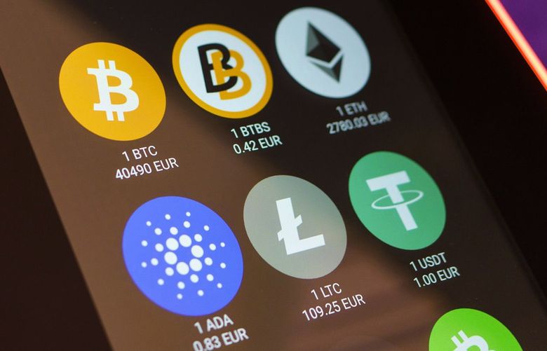 Cryptocurrency logos displayed on an automated teller machine inside a shopping center in Madrid, Spain on March 16, 2022. MUST CREDIT: Bloomberg photo by Angel Navarrete.