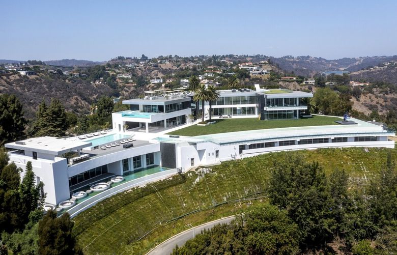 An aerial view of “The One,” taken in Bel-Air on Sept. 8, 2021, in Beverly Hills, California. The 105,000-square-foot mansion has a sky deck and putting green, night club, several swimming pools, a 50-seat theater, a four-lane bowling alley and more. (Allen J. Schaben/Los Angeles Times/TNS) 41674473W 41674473W