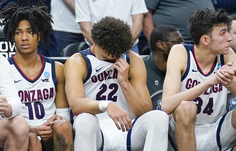 Gonzaga guard Hunter Sallis (10) sits on the bench next to forward Anton Watson (22) and center Chet Holmgren, right, during the second half against Arkansas in the Sweet 16 round of the NCAA tournament in San Francisco, Thursday. (AP Photo/Marcio Jose Sanchez) CAJC159