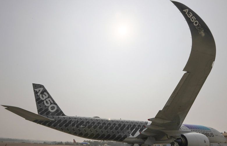 An Airbus A350 stands on static display during Wings India 2022 international exhibition and conference on civil aviation at Begumpet airport in Hyderabad, India, Thursday, March 24, 2022. (AP Photo/Mahesh Kumar A.) HYD109