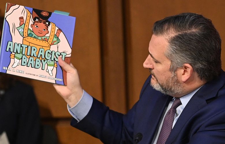 US Senator Ted Cruz (R-TX) holds a book titled “Antiracist Baby” while speaking during the confirmation hearing for Judge Ketanji Brown Jackson before the Senate Judiciary Committee on her nomination to be an Associate Justice on the US Supreme Court, in the Hart Senate Office Building on Capitol Hill in Washington, DC, on March 22, 2022. (Saul Loeb/AFP via Getty Images/TNS) 43542154W 43542154W