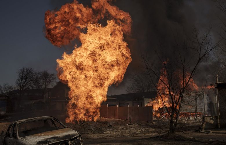 Flames and smoke rise from a fire following a Russian attack in Kharkiv, Ukraine, Friday, March 25, 2022. (AP Photo/Felipe Dana) XFD112 XFD112