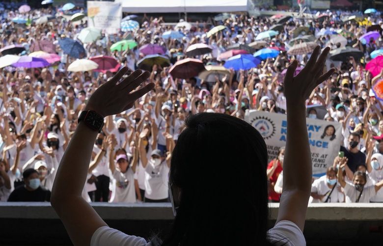 Quezon City Mayor Joy Belmonte greets supporters as she starts her re-election campaign in Quezon City, Philippines on Friday, March 25, 2022. Candidates for thousands of provincial, town and congressional posts started campaigning across the Philippines Friday under tight police watch due to a history of violent rivalries and to enforce a lingering pandemic ban on handshakes, hugging and tightly packed crowds that are a hallmark of often circus-like campaigns. (AP Photo/Aaron Favila) XAF111 XAF111