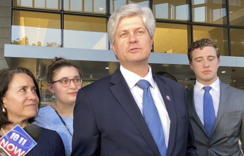 U.S. Rep. Jeff Fortenberry, R-Neb., center, speaks with the media outside the federal courthouse in Los Angeles, Thursday, March 24, 2022. Fortenberry was convicted Thursday of charges that he lied to federal authorities about an illegal $30,000 contribution to his campaign from a foreign billionaire at a 2016 Los Angeles fundraiser. (AP Photo/Brian Melley) RPBM201 RPBM201