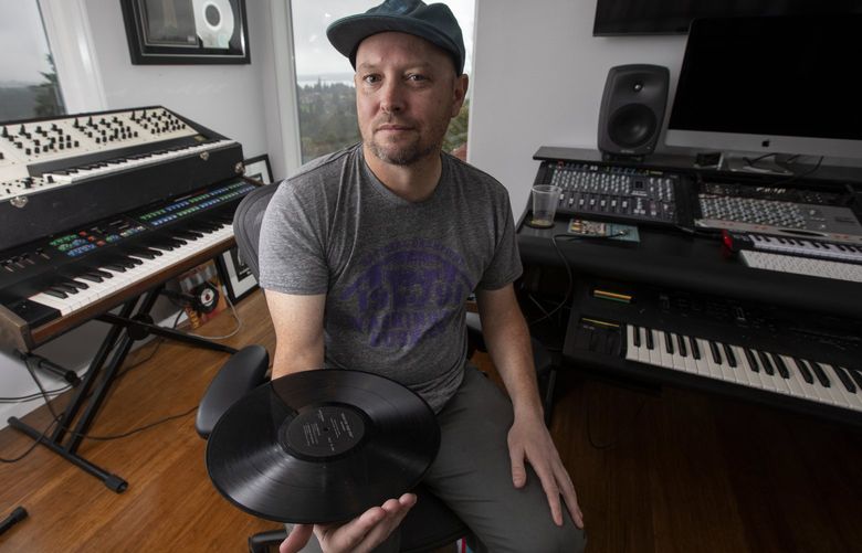 Hip-hop producer Jake One (real name Jacob Dutton) in his home studio Tuesday, Jan. 18, 2022 in Seattle. Jake is a Seattle hip-hop luminary who makes beats for some of the biggest rap stars in the game and is up for several Grammys. 219346