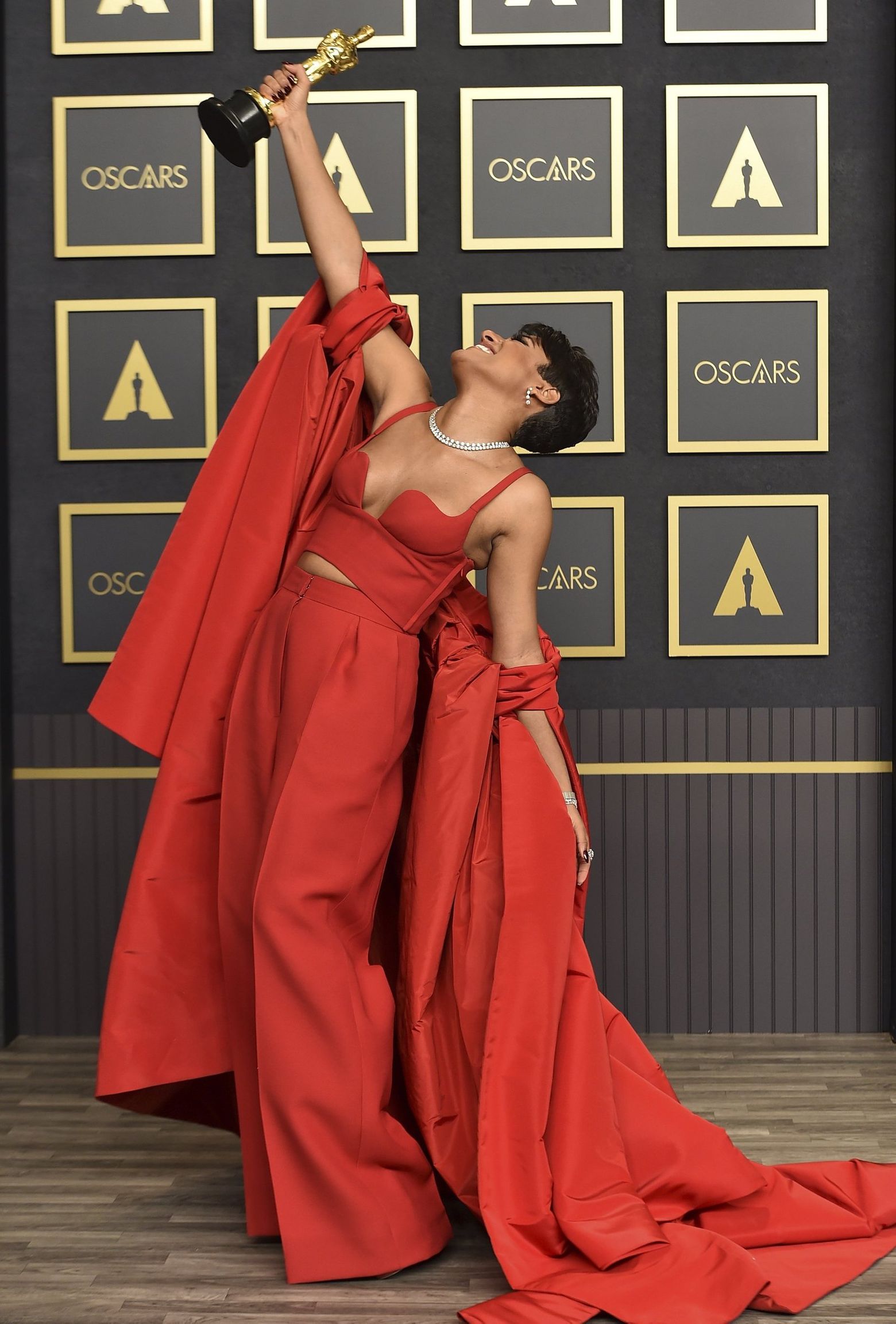 ariana oscars red dress Was That a Shoe on the Back of Ariana Grande's Oscars Dress?