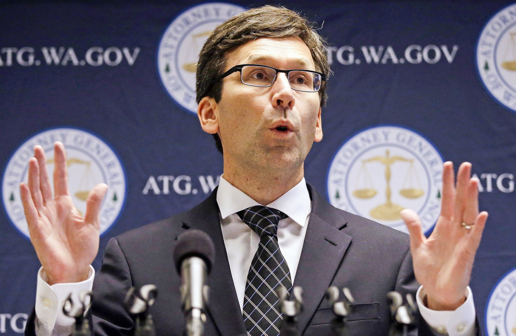 Attorney General Bob Ferguson speaks at a press conference
