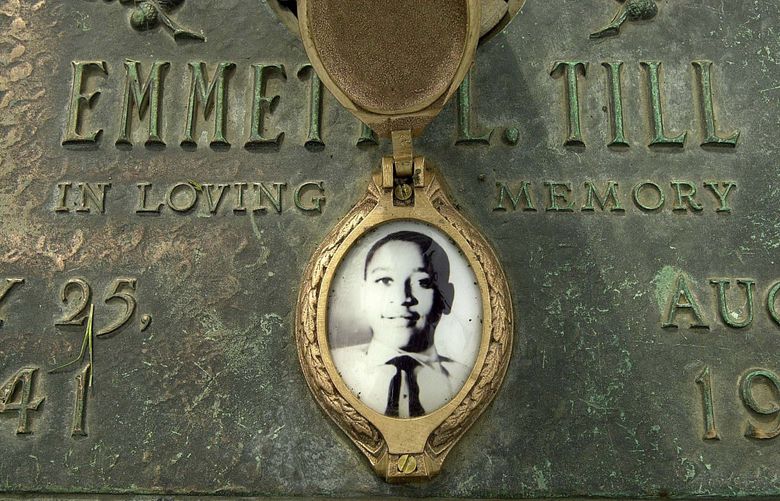 FILE – In this May 4, 2005 file photo, Emmett Till’s photo is seen on his grave marker in Alsip, Ill. Legislation that would make lynching a federal hate crime in the U.S. is expected to be signed into law next week by President Joe Biden. The Emmett Till Anti-Lynching Act was years in the making. (Robert A. Davis/Chicago Sun-Times via AP, File) ILCHS501 ILCHS501