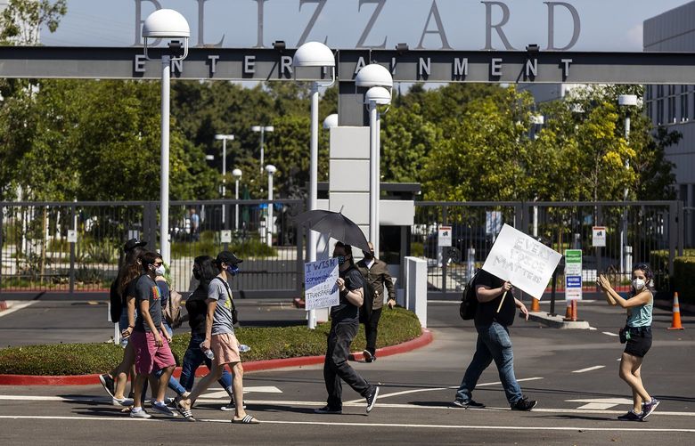 Several hundred Activision Blizzard employees stage a walkout on July 28, 2021, outside the gate at Activision Blizzard headquarters in Irvine, California. (Allen J. Schaben/Los Angeles Times/TNS) 43904764W 43904764W