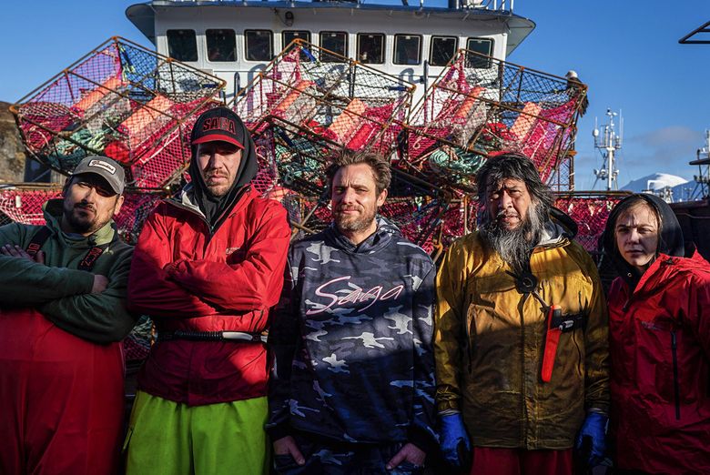 The crew of the fishing boat Saga, from left Joe Gomez, Mason Twyman, captain Jake Anderson, Mac White, and Shyanne Smith, pose for a photo on the boat on Wednesday, Jan. 12, 2022 in Dutch Harbor. (Loren Holmes / ADN) (Loren Holmes / Loren Holmes)