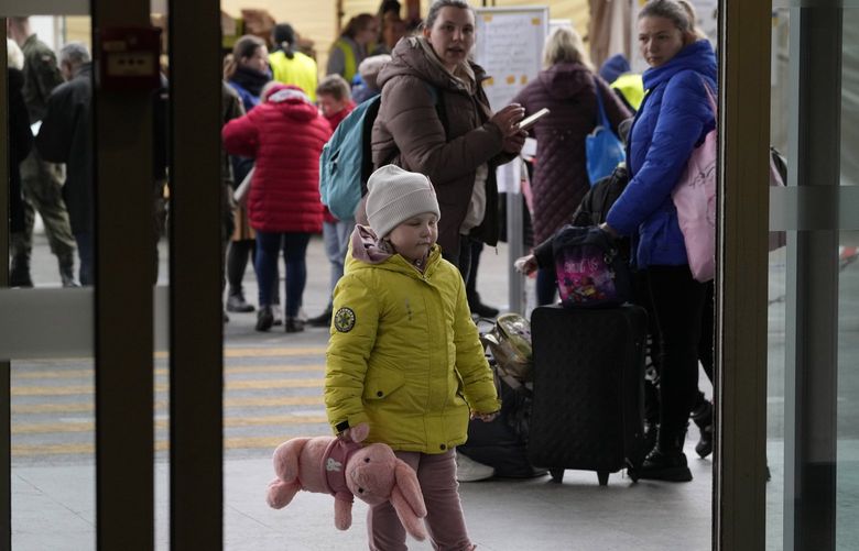 Ukrainian refugees wait at central train station in Warsaw, Poland, on Wednesday, March 30, 2022. The U.N. refugee agency says more than 4 million people have now fled Ukraine following Russia’s invasion, a new milestone in the largest refugee crisis in Europe since World War II. (AP Photo/Czarek Sokolowski) XTS122 XTS122
