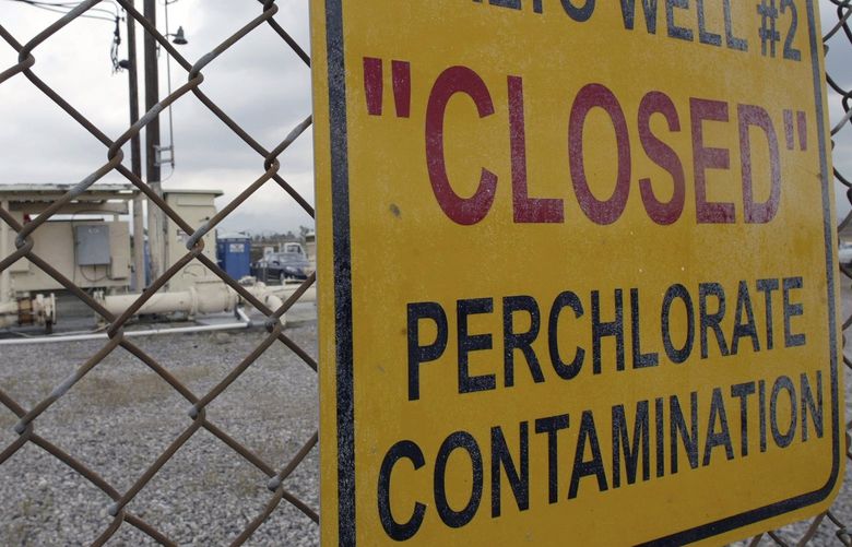 FILE – In this March 28, 2005, photo, a sign posted outside a water well indicates perchlorate contamination at the site in Rialto, Calif. Upholding a Trump-era environmental policy, the Environmental Protection Agency says it will not regulate the drinking water contaminant that has been linked to brain damage in infants. (AP Photo/Ric Francis, File) WX115 WX115