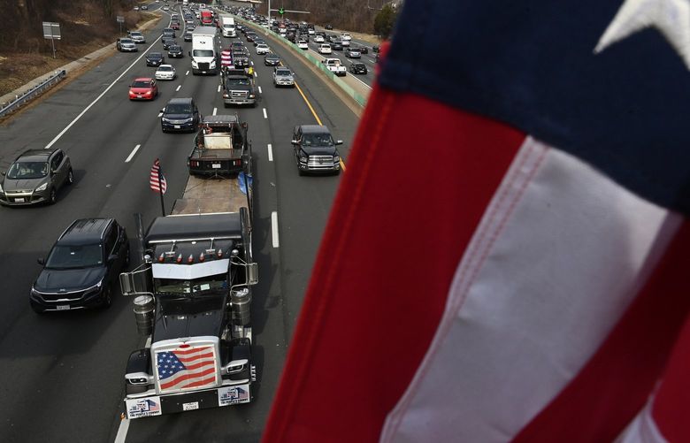 A convoy protesting coronavirus-related mandates makes its way along Interstate 495 South on March 6 in McLean, Va. MUST CREDIT: Washington Post photo by Matt McClain