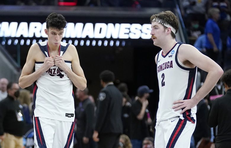 Gonzaga guard Hunter Sallis (10), center Chet Holmgren, middle, and forward Drew Timme react after Gonzaga was defeated by Arkansas in a college basketball game in the Sweet 16 round of the NCAA tournament in San Francisco, Thursday, March 24, 2022. (AP Photo/Marcio Jose Sanchez) CAJC167 CAJC167
