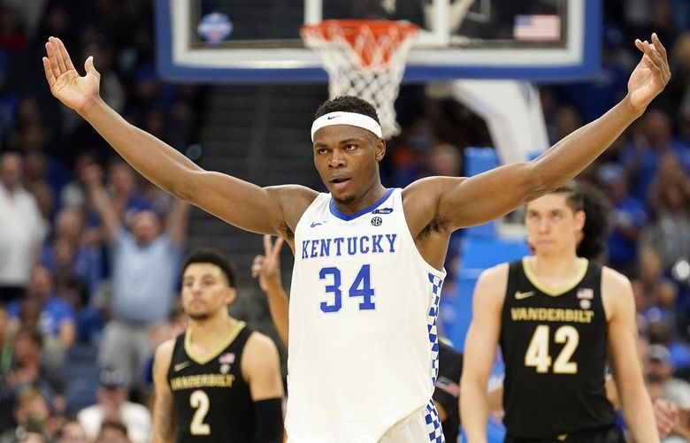 Kentucky forward Oscar Tshiebwe (34) celebrates during the second half of the team’s NCAA college basketball game against Vanderbilt in the Southeastern Conference men’s tournament Friday, March 11, 2022, in Tampa, Fla. (AP Photo/Chris O’Meara) TPA178 TPA178