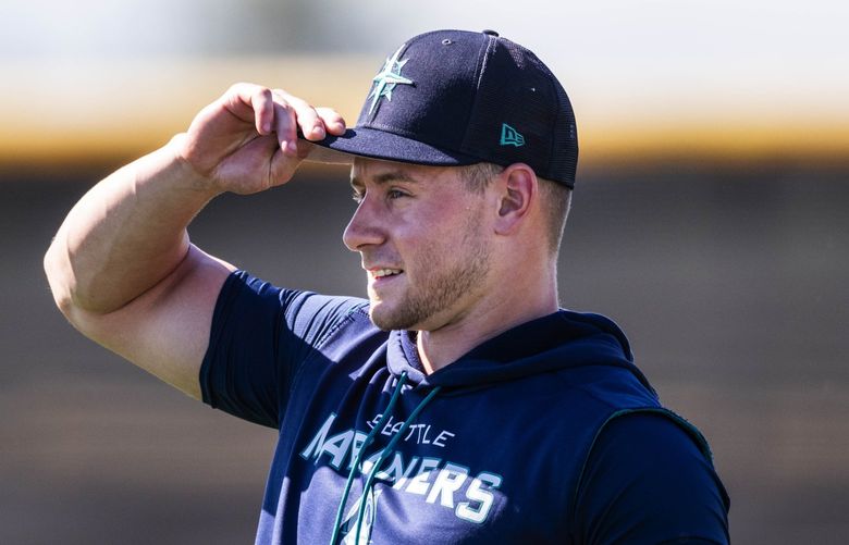 Jarred Kelenic talks to Jesse Winker during practice Tuesday.
­
The Seattle Mariners held Spring Training for the 2022 baseball season Tuesday, March 15, in Peoria, AZ. 219851