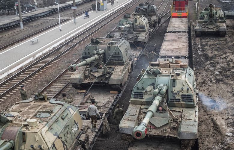 FILE â€” Russian howitzers are loaded onto train cars at a station outside Taganrog, Russia, near the border with Ukraine, on Tuesday, Feb. 22, 2022. In a few frantic days, the West threw out the playbook it used for decades against the Kremlin and isolated Russia with unparalleled sanctions and penalties.   (The New York Times)