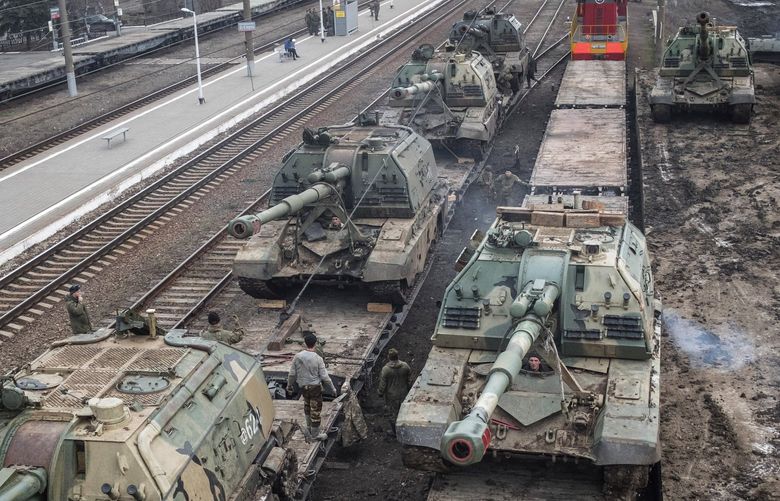 FILE — Russian howitzers are loaded onto train cars at a station outside Taganrog, Russia, near the border with Ukraine, on Tuesday, Feb. 22, 2022. In a few frantic days, the West threw out the playbook it used for decades against the Kremlin and isolated Russia with unparalleled sanctions and penalties. (The New York Times)