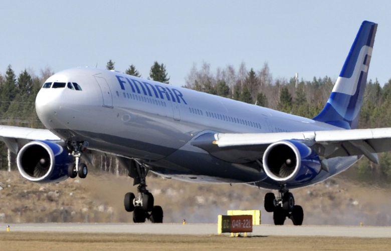 The Finnair flight AY006 from New York lands at the Helsinki International Airport in Vantaa Finland  on Monday  April 19, 2010. The flight was the first to land at the Helsinki Airport after the closure of airspace because of a volcanic ash cloud. (AP Photo/LEHTIKUVA / Jussi Nukari)  ** FINLAND OUT NOY SALES  **