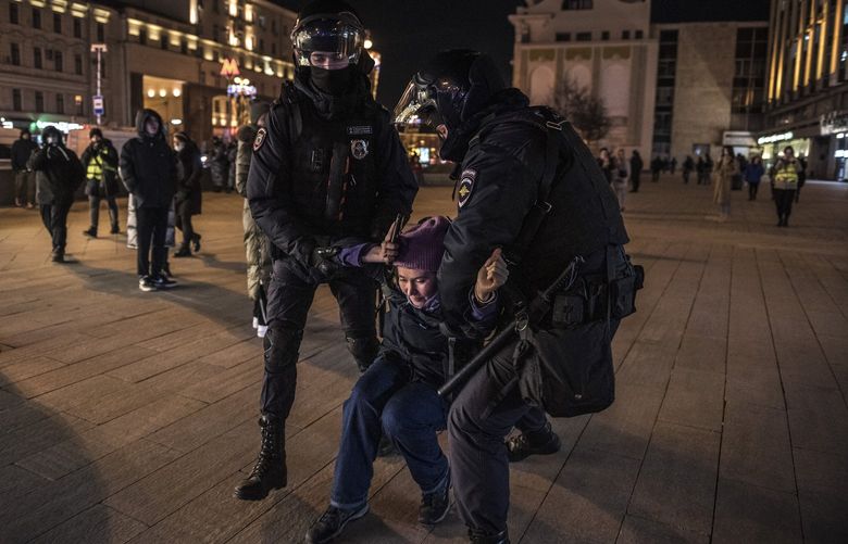 FILE – Police detain an anti-war protester in central Moscow, Russia, Feb. 25, 2022. A series of shifts in Russian statements about using nuclear weapons has led some analysts to believe that the Kremlin sees a nuclear exchange as a viable strategy. (The New York Times)