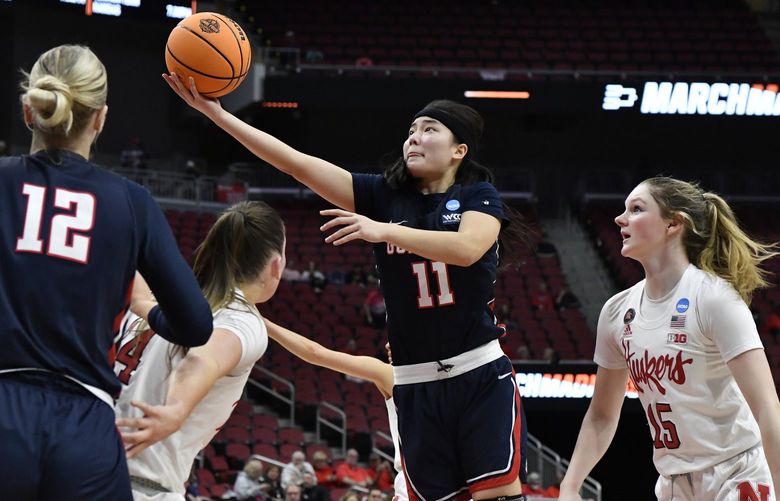 Gonzaga guard Kayleigh Truong (11) goes in for a layup past the Nebraska defense during the first half of their women’s NCAA Tournament college basketball first round game in Louisville, Ky., Friday, March 18, 2022. (AP Photo/Timothy D. Easley) KYTE120 KYTE120