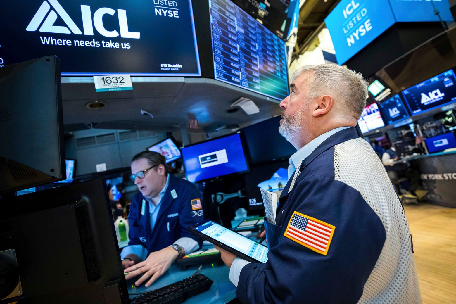 Stocks end another bumpy day lower and crude oil prices ease | The Seattle Times