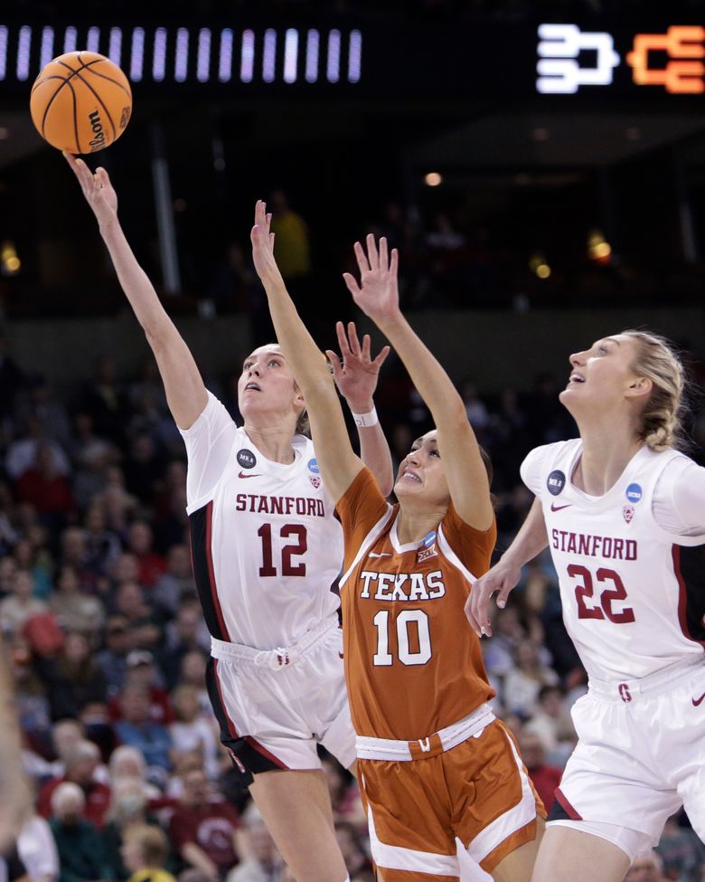 Stanford guard Lexie Hull (12) puts up a shot against Texas guard Shay Holle (10) as Stanford forward Cameron Brink (22) looks on during the second half of a college basketball game in the Elite 8 round of the NCAA tournament, Sunday, March 27, 2022, in Spokane, Wash. (AP Photo/Young Kwak)