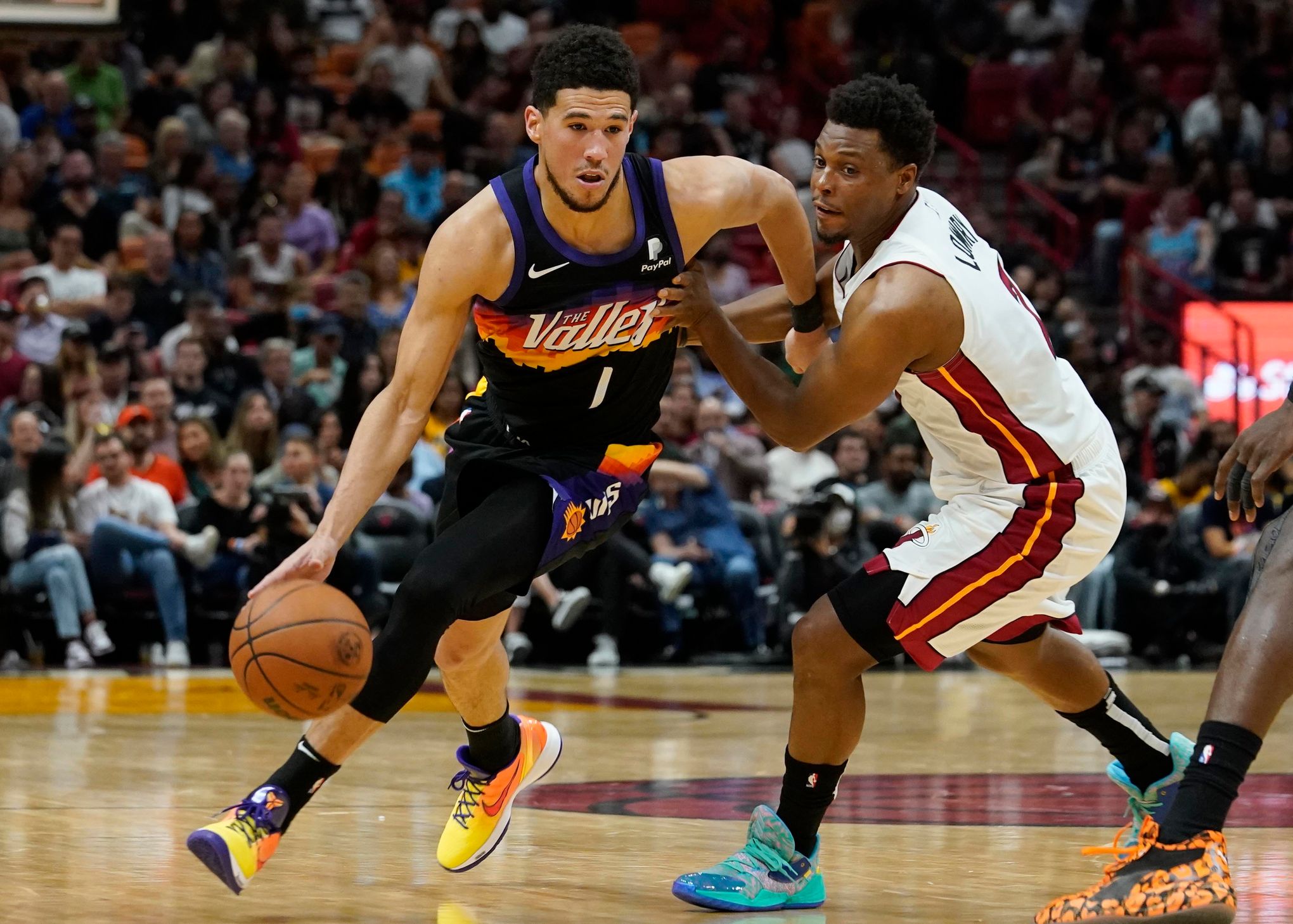 Booker has 23 points in return, Suns roll past Heat 111-90