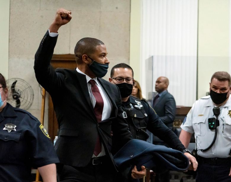 Actor Jussie Smollett is led out of the courtroom after being sentenced at the Leighton Criminal Court Building on Thursday in Chicago. Jussie Smollett maintained his innocence during his sentencing hearing Thursday after a judge sentenced the former “Empire” actor to 150 days in jail for lying to police about a racist and homophobic attack that he orchestrated himself.(Brian Cassella / Chicago Tribune via AP, Pool)