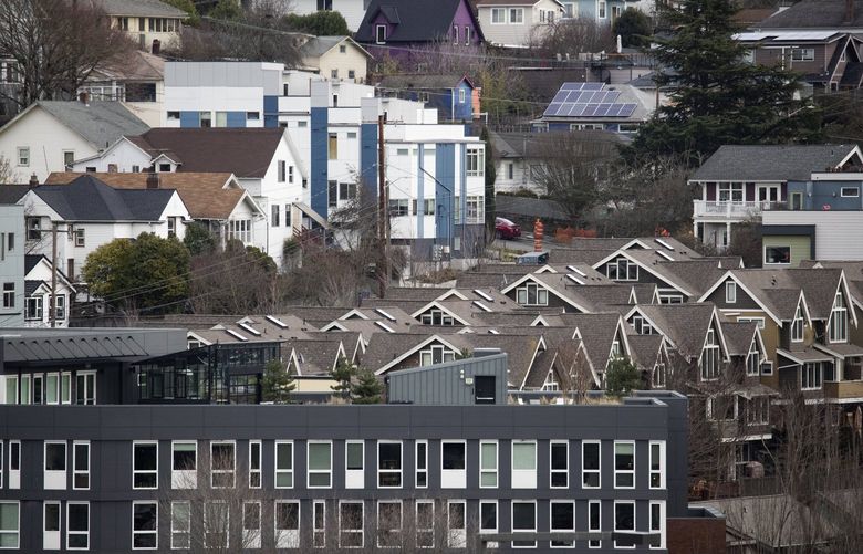 An assortment of older and newer homes are seen in the Central District’s Atlantic neighborhood, Tuesday, Feb. 1, 2022 in Seattle. The view is from Beacon Hill.
 14845779