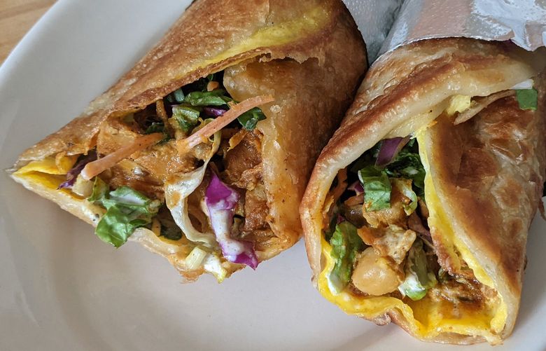 The Roll Pod specializes in fluffy roti, tightly wrapped around a fried egg, crunchy slaw, and your choice of filling. Both the chicken and chana masala fillings have real main character energy, so full of well-balanced spice and a good eggy finish.