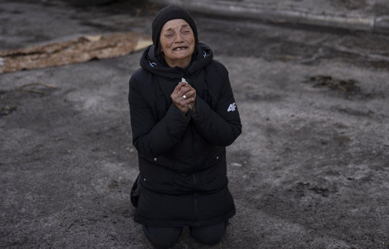Tanya Nedashkivs’ka, 57, mourns her husband, killed in Bucha, on the outskirts of Kyiv, Ukraine, Monday, April 4, 2022. Russia is facing a fresh wave of condemnation after evidence emerged of what appeared to be deliberate killings of civilians in Ukraine. (AP Photo / Rodrigo Abd)