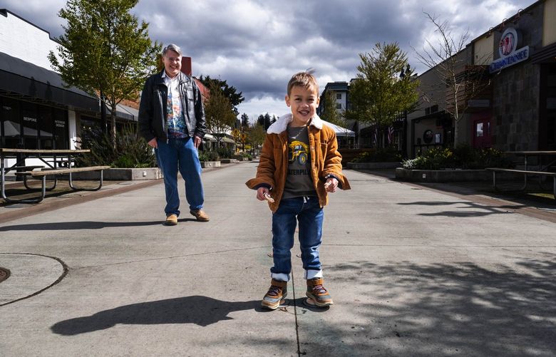 Odin Eisenberg is particularly fond of playing in the middle of the street – and that’s okay by his father, Eric, background – so long as it’s in downtown Bothell where a block-long stretch of Main Street has been closed since the beginning of the pandemic.  Bothell’s City Council just voted to extend that closure an additiional two-year, and is considering making that closure permanent.

The possibility of permanently closing a one-block stretch of Main Street in downtown Bothell is generally popular in the city.  And the council moved one step in that direction by extending the closure for two more years.

Photographed Friday, April 1, 2022 220009