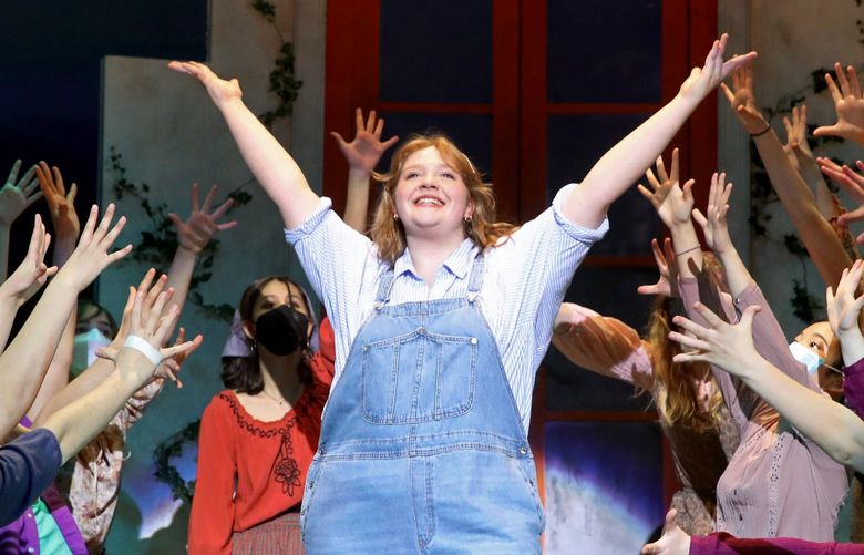 Roosevelt High School senior Eloise Maguire, center, performs the lead of “Donna” at the dress rehearsal for “Mamma Mia!” Monday, Feb. 28, 2022 in Seattle.