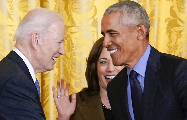 Vice President Kamala Harris reacts as President Joe Biden shakes hands with former President Barack Obama after Obama jokingly called Biden vice president in the East Room of the White House in Washington, Tuesday, April 5, 2022. (AP Photo/Carolyn Kaster) DCCK415 DCCK415