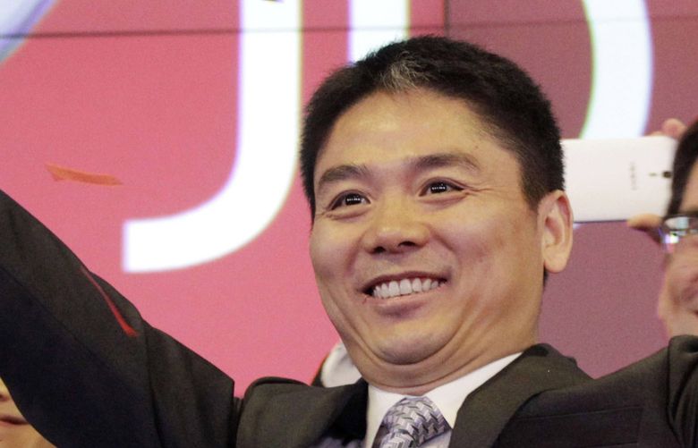 FILE – Liu Qiangdong, also known as Richard Liu, CEO of JD.com, raises his arms to celebrate the IPO for his company at the Nasdaq MarketSite, in New York on May 22, 2014. Chinese e-commerce company JD.com said Thursday, April 7, 2022, that its founder Richard Liu has left his position as CEO, the latest Chinese billionaire tech company founder to step aside amid increased government scrutiny of the countryâ€™s technology industry.(AP Photo/Mark Lennihan, File) TKSJ101 TKSJ101